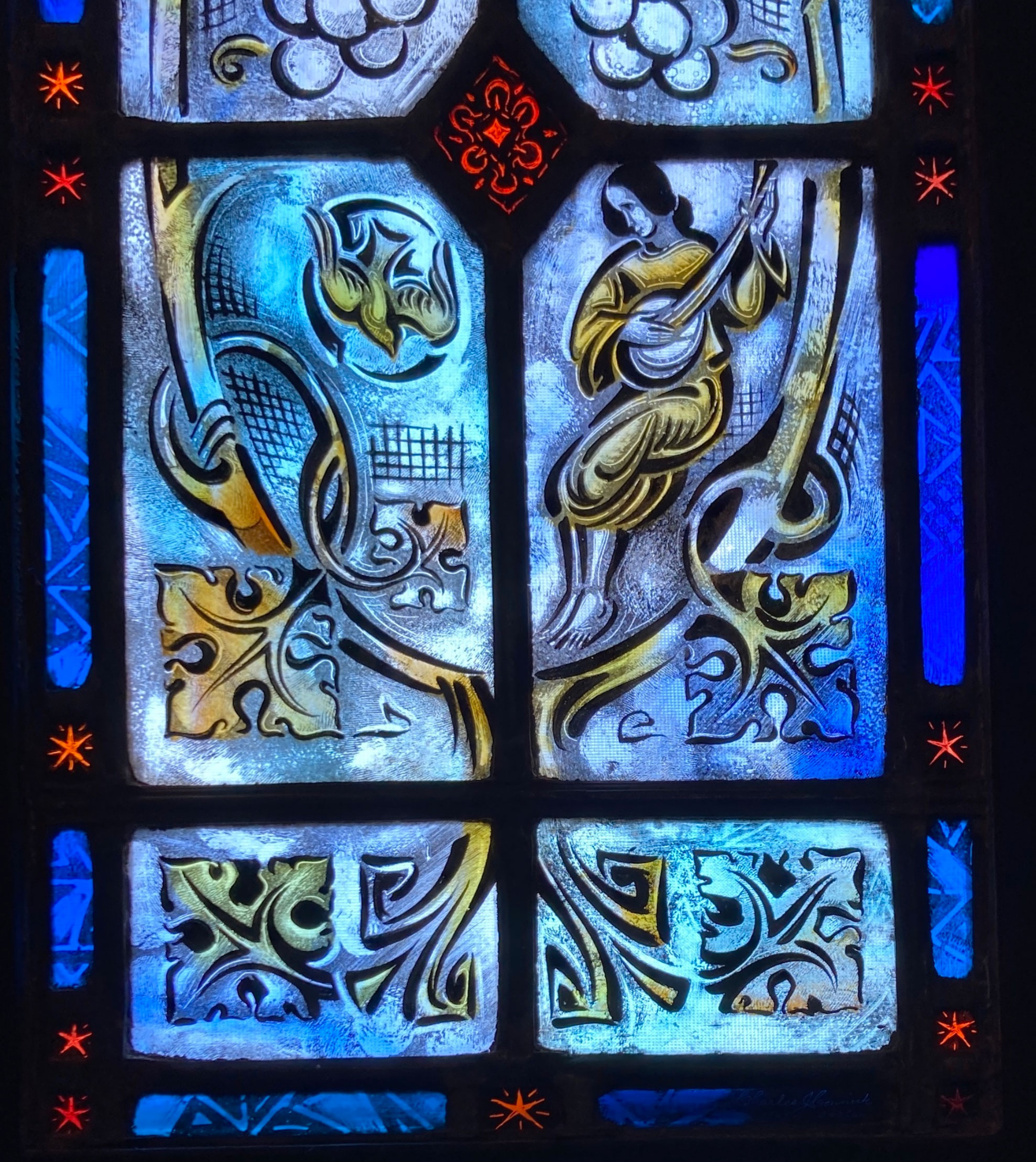 Stained glass memorial window detail at St. Peter’s Episcopal Cathedral
